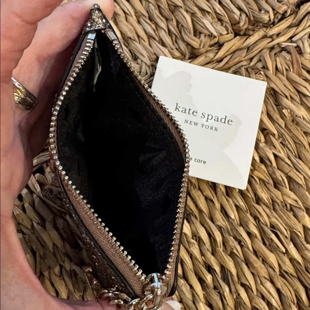 Kate Spade glitter clutch wristlet in gold and black